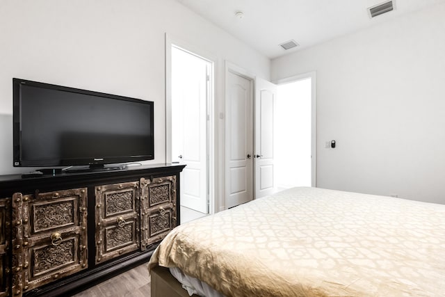 bedroom with light wood-type flooring