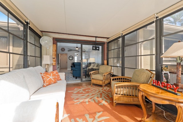 sunroom / solarium featuring ceiling fan