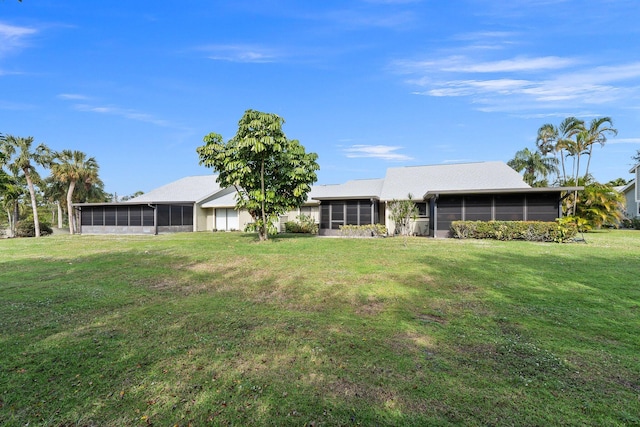 view of yard featuring a sunroom