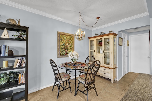 dining space with light tile patterned flooring, ornamental molding, a textured ceiling, and an inviting chandelier