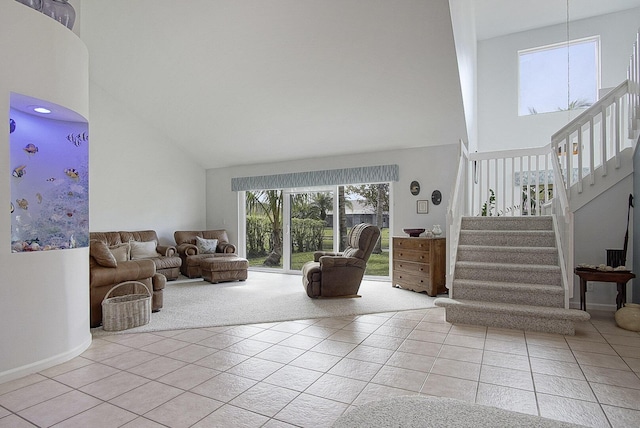 living room featuring light tile patterned floors and a towering ceiling