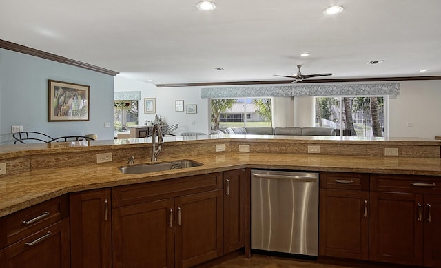 kitchen with stainless steel dishwasher, ceiling fan, a healthy amount of sunlight, and sink