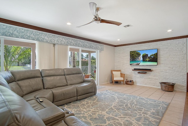 tiled living room featuring ceiling fan and ornamental molding