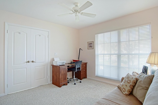 office featuring ceiling fan and light colored carpet