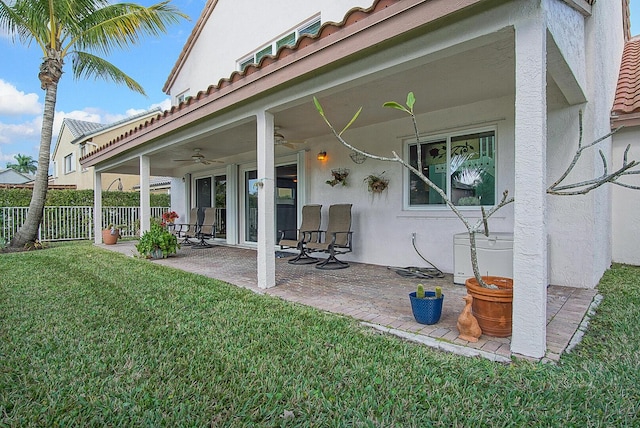 exterior space featuring ceiling fan