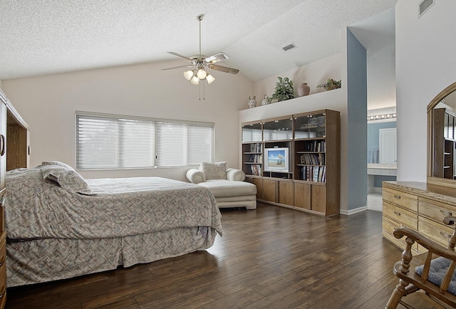 bedroom featuring ceiling fan, dark hardwood / wood-style flooring, lofted ceiling, and a textured ceiling