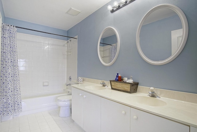 full bathroom featuring tile patterned flooring, vanity, toilet, and shower / tub combo with curtain