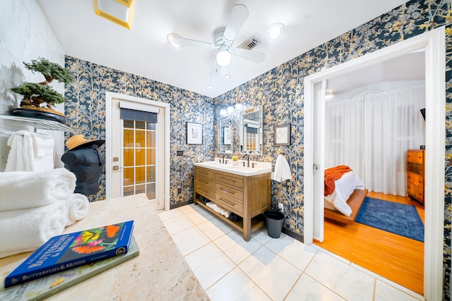 bathroom featuring wallpapered walls, visible vents, a ceiling fan, ensuite bathroom, and vanity