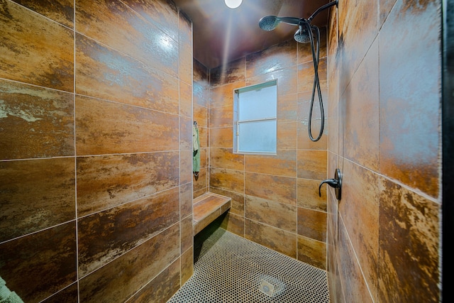 full bath with tiled shower