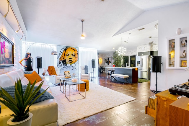 living area featuring vaulted ceiling and visible vents