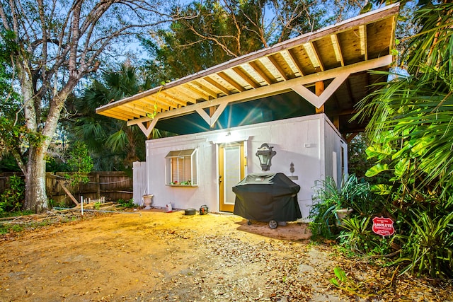 view of outdoor structure with fence