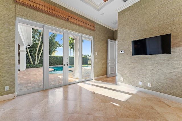 interior space with ornamental molding and french doors