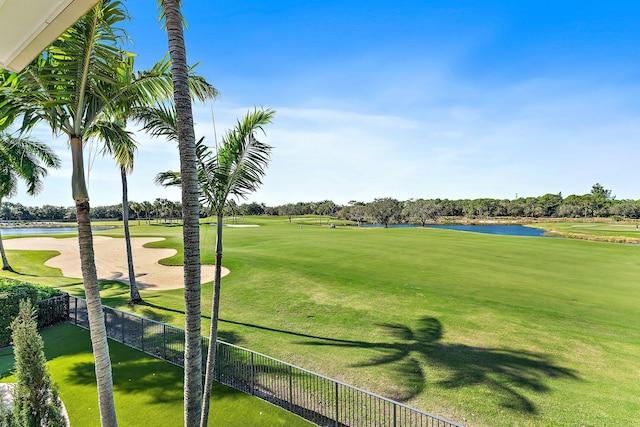 view of property's community featuring a yard and a water view