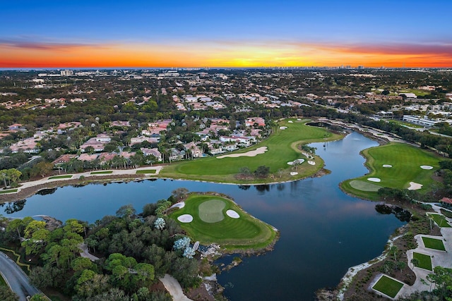 aerial view at dusk with a water view