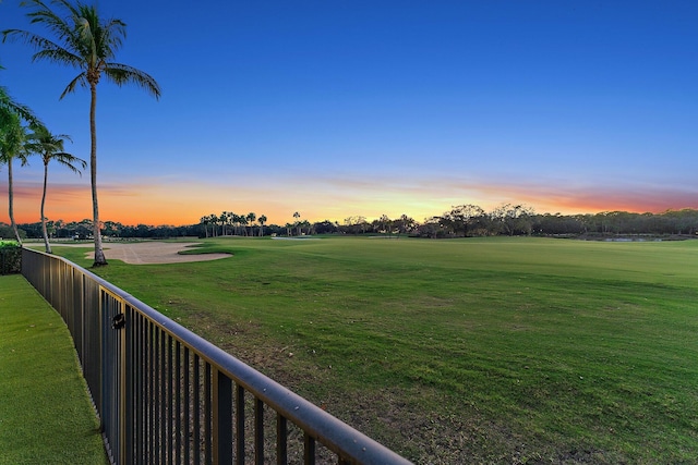 view of yard at dusk