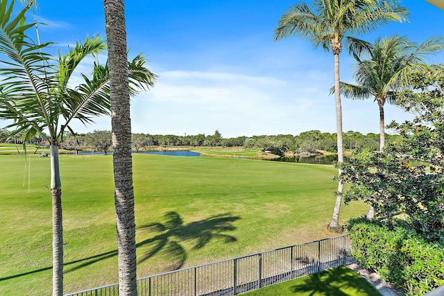 surrounding community featuring a yard and a water view