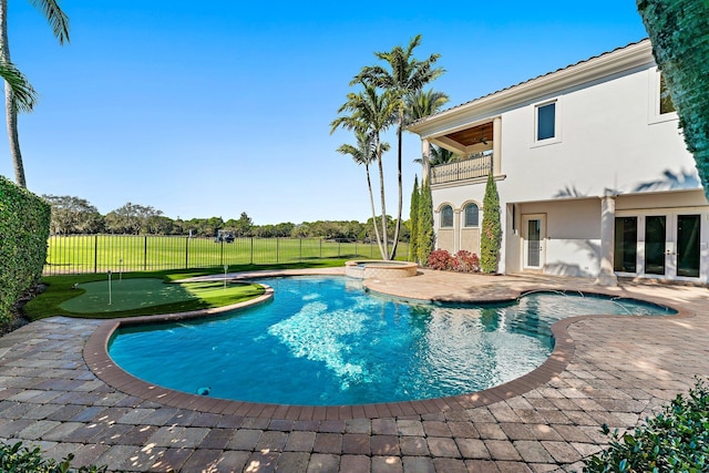 view of pool featuring a yard