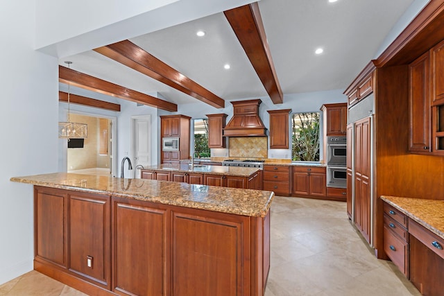 kitchen featuring a spacious island, light stone countertops, appliances with stainless steel finishes, beamed ceiling, and custom range hood