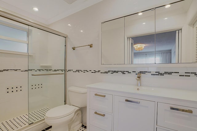 full bath featuring tasteful backsplash, toilet, vanity, a shower stall, and tile walls