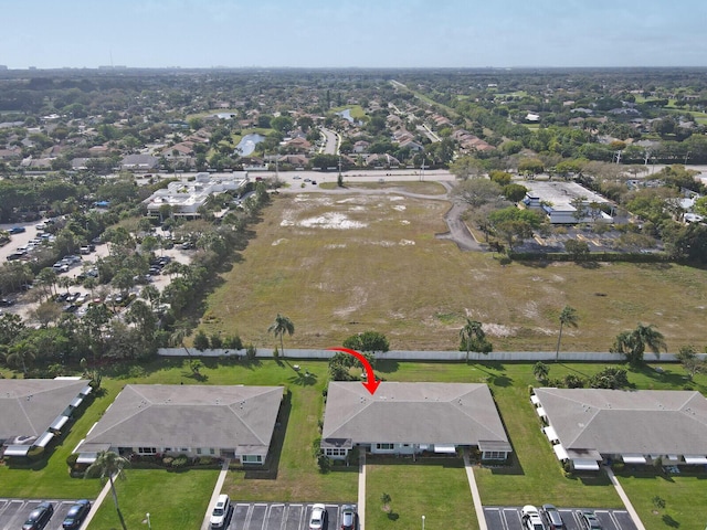 birds eye view of property with a residential view