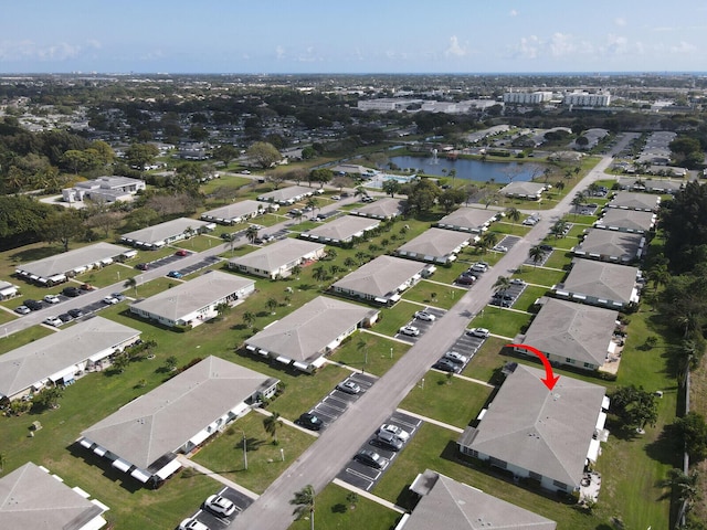 birds eye view of property featuring a water view and a residential view