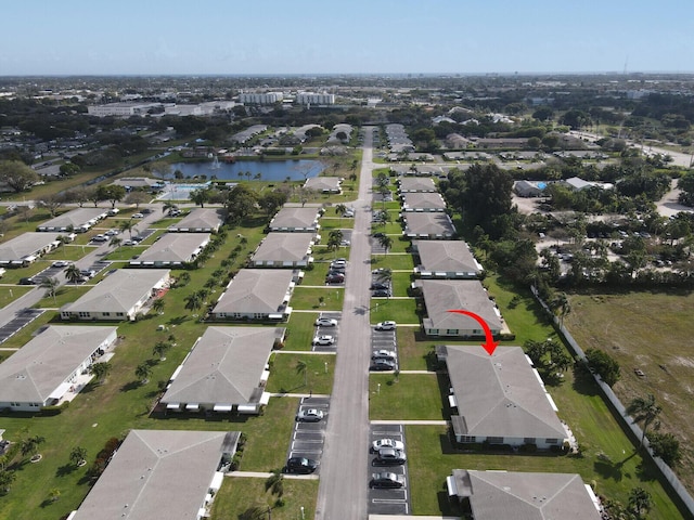 birds eye view of property featuring a residential view and a water view