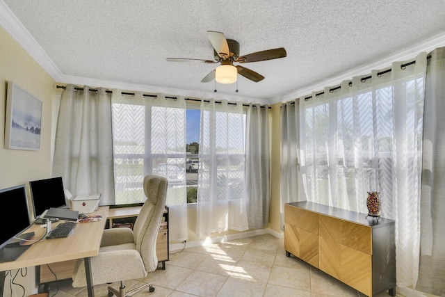 office with a healthy amount of sunlight, ceiling fan, and light tile patterned flooring