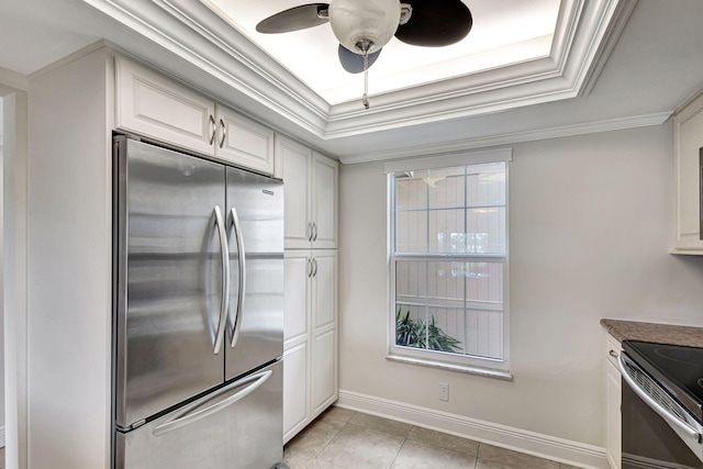 kitchen featuring light tile patterned floors, white cabinetry, crown molding, and appliances with stainless steel finishes