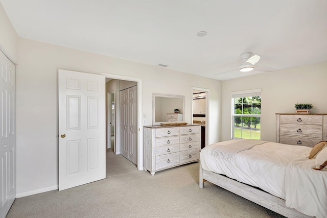 carpeted bedroom with ceiling fan