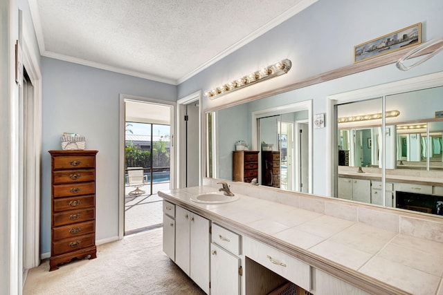 bathroom featuring vanity and a textured ceiling