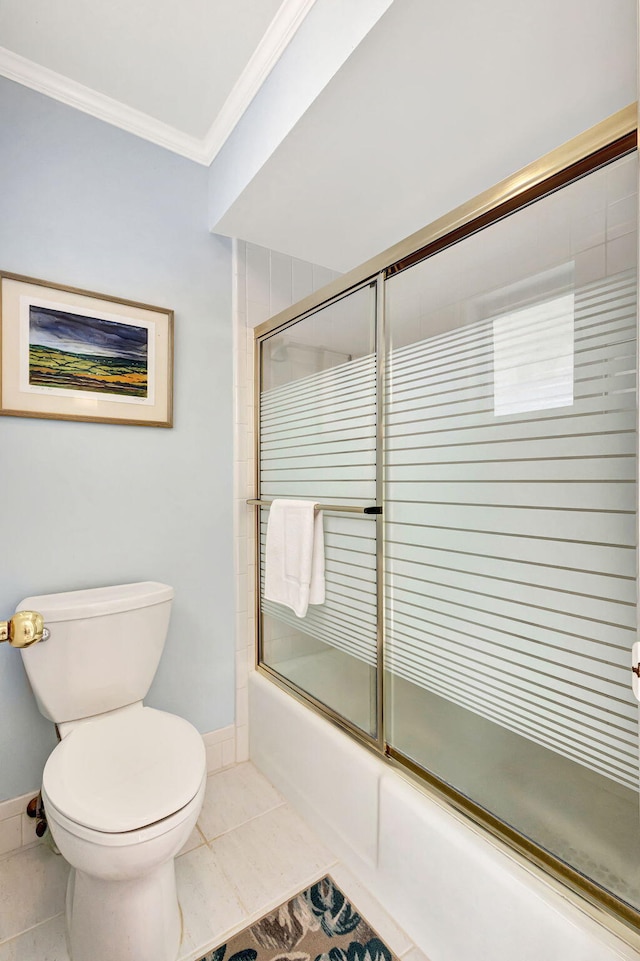 bathroom with shower / bath combination with glass door, tile patterned floors, crown molding, and toilet