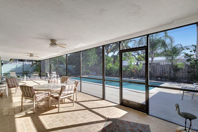 sunroom / solarium with ceiling fan