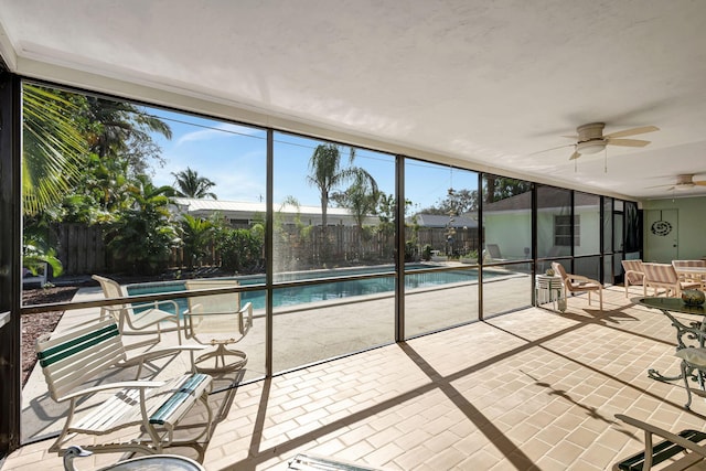 view of pool featuring ceiling fan