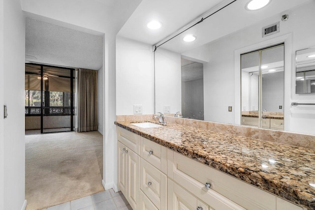 bathroom with vanity and tile patterned floors