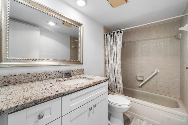 full bathroom featuring vanity, toilet, and shower / tub combo with curtain