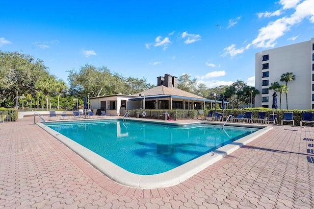 view of swimming pool with a patio