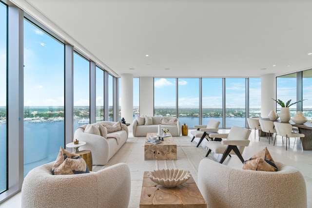 sunroom / solarium with a wealth of natural light and a water view