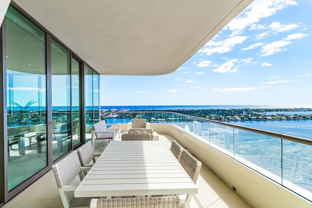 balcony featuring a water view