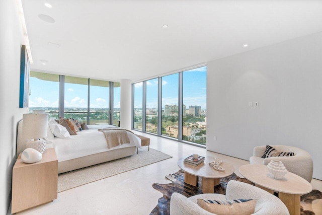 bedroom featuring access to exterior and floor to ceiling windows