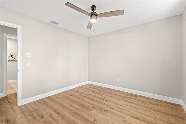 spare room with ceiling fan and light hardwood / wood-style floors