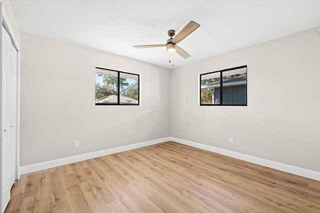 unfurnished room with ceiling fan and light hardwood / wood-style floors