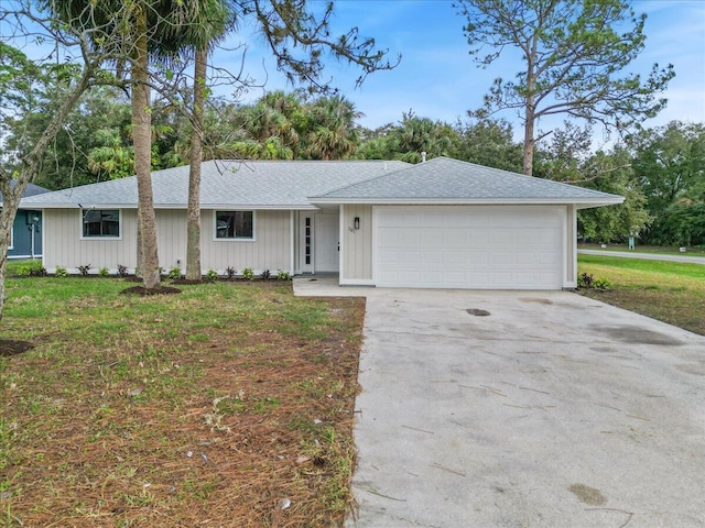 ranch-style home featuring a garage and a front yard