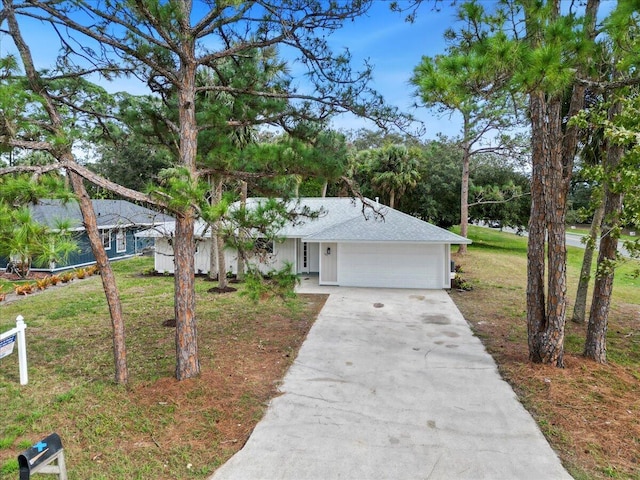 ranch-style house with a front yard and a garage