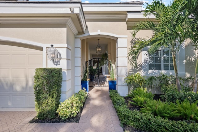 view of exterior entry with a garage