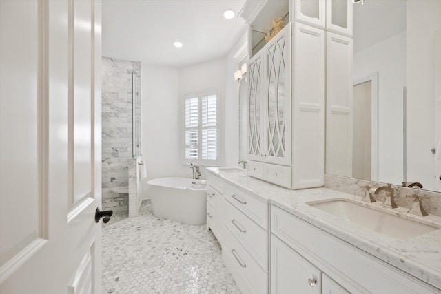 bathroom featuring plus walk in shower and vanity