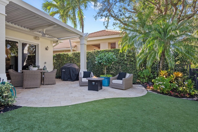 view of patio / terrace with an outdoor fire pit and a grill