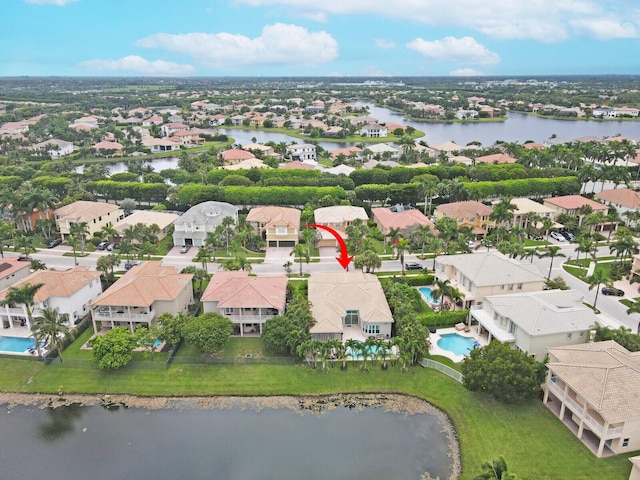 birds eye view of property featuring a water view