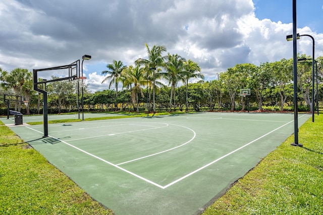 view of basketball court featuring a lawn