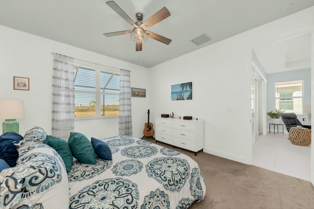 bedroom with ceiling fan and carpet