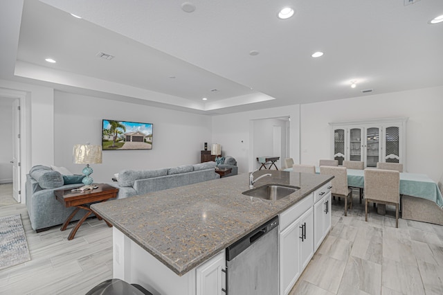 kitchen featuring white cabinetry, sink, dishwasher, and a kitchen island with sink